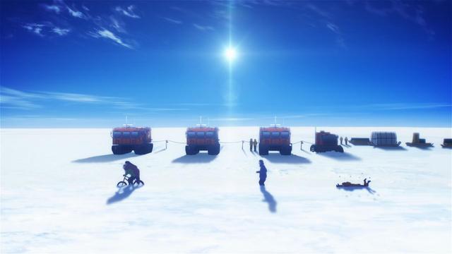 Hinata and Yuzuki attempt to ride a bicycle through the snow while Shirase trudges along after them and Mari stumbles to their rear. In the background are four orange Sno-Cats parked in a left to right line, an expansive blue sky with a few wispy clouds, and a bright sun hanging in the middle of the sky.
